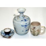 A Chinese blue and white spouted vessel, a Chinese blue and white saucer,