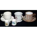 A Worcester Edwardian miniature cup with floral decoration and a Hayle souvenir cup and saucer with