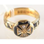 An 18 ct. gold memoriam ring with black enamel and diamonds, makers mark T.E.