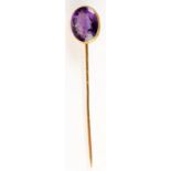 A 18ct. gold stick pin, the finial, an intaglio carved amethyst.