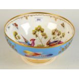 An English 20th century porcelain Regency style large bowl painted with exotic birds the exterior