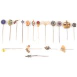 A collection of novelty and other pins, including a gilt snake, a fossil and a glass satchel.