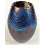 A Norman Stuart Clarke vase with iridescent peacock feather decoration, height 15.