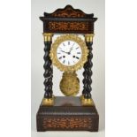 A French ebony and marquetry mantle clock with four spiral columns,