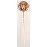 A William Essex enamelled dog's head gold pin, the back signed and dated 1863, diameter 1.