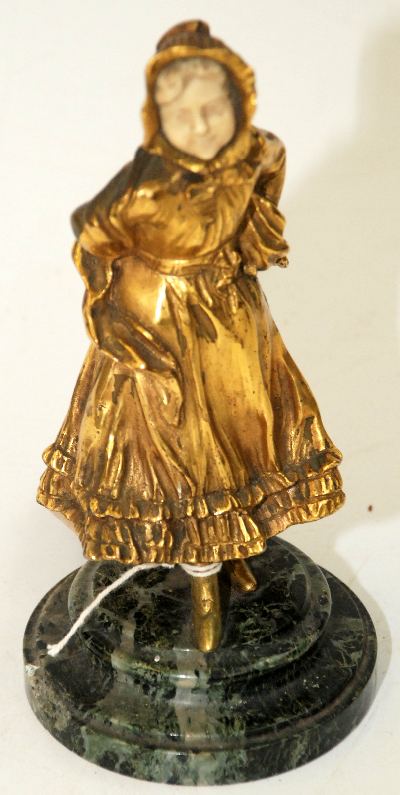 A continental gilt bronze and ivory figure of a girl wearing a bonnet, marble base, height 19cm. - Image 2 of 2