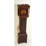 A watch holder in the form of a mahogany longcase clock.