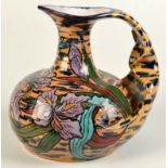 A saience Art Nouveau iris decorated jug retailed by Au Bon Marche Paris,