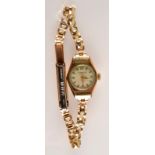 A ladies 9ct. gold case wristwatch.