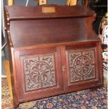 A Keswick Art and Crafts carved mahogany wall cabinet, inscribed 'presented to Miss E.