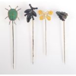 Four insect pins.