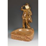 A continental pre war bronze and ivory model of boy clown holding a mandolin, onyx ashtray base,