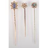A gold pin with diamond and pearl flower finial,