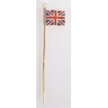 A gold patriotic pin finely enamelled with a fluttering Union flag on a flag post with pearl finial