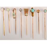 Eight opal set pins.