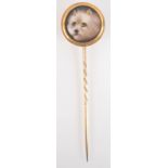 A John William Bailey gold stick pin, the finial with a painted enamel terrier signed to the back J.