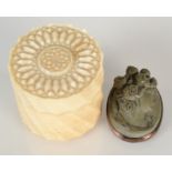 An 'ornamental turned' miniature ivory box, together with a carved larvae cameo.