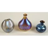 Three Norman Stuart Clarke small iridescent vases, each signed.