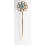 A gold pin the cluster finial with central green stone surrounded by pearls, boxed.