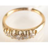 An 18ct. gold Victorian style ring set five diamonds.