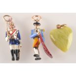 Two enamelled gold pendants, one in the form of a bull fighter, the other a guardsman,