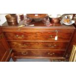 An 18th century mahogany chest of three long graduated drawers beneath a brushing slide,