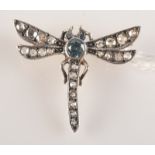 A diamond and aquamarine set small dragonfly brooch.