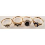 Two sapphire and diamond cluster rings and two other gold rings.