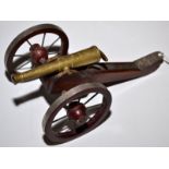 A working model breech loading cannon. Cannon barrel is 13cm long. Carriage is 20cm.