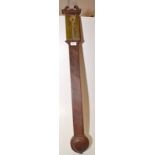 A stick barometer by Watkins, Charing Cross in mahogany case with swan neck pediment.