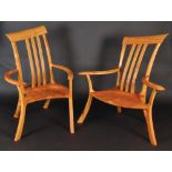 A pair of David Savage bespoke love chairs in elm.