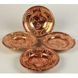 A set of three 17th or 18th century Hispano Moresk copper lustre dishes, diameter 20.