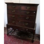 An 18th century oak chest of drawers on dissimilar stand.