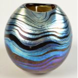 A globular Norman Stuart Clarke iridescent vase signed and numbered PBG85, height 10cm.