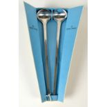A pair of Georg Jensen matte stainless steel salad servers in original conical box,