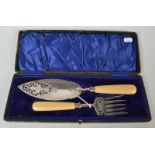 A pair of good Victorian fish servers with well pierced and engraved blades and celluloid handles,