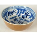 A Chinese blue and white bowl decorated to the interior with fan tailed goldfish,