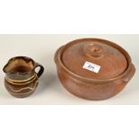 A Leach Pottery stoneware cooking pot with lid, together with a small jug.