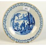 A mid 18th century English tin glaze blue and white dish, diameter 23.2cm.