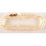 A cultured pearl necklace with 9 ct. gold clasp.