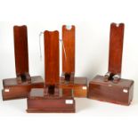 Four mahogany lead weighted saucer dish stands.