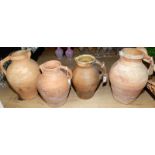 Three large Lakes Pottery jugs and a North Devon jug.