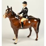 A Beswick huntswoman on a brown horse.