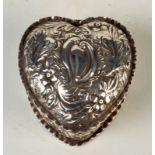 A Victorian silver embossed heart shaped box with hinged lid.