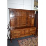 A good George III oak crossbanded and chevron strung dresser,