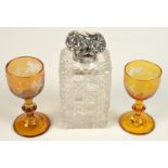Two Bohemian amber flash stemmed glasses and a Victorian cut glass toilet bottle with silver hinged