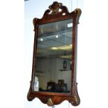 A George III style rectangular mirror in a mahogany frame with a fleur de lis mount,