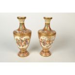 A pair of Japanese Satsuma vases, 19th century, gilt decorated with lady's in an interior scene,