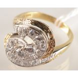 A 14ct gold post war swirl ring set with diamonds.