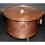 A Scandinavian cylindrical lidded copper pan, on three conical legs, diameter 47cm.
